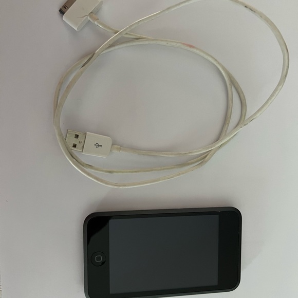 Apple iTouch 16 GB and charging cord. - Picture 1 of 4